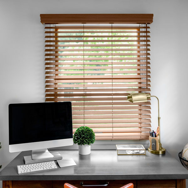 Faux wood blinds beautify a home office nook.