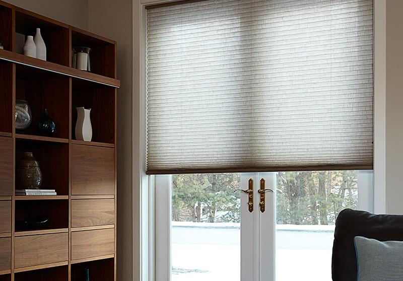 Cordless cellular shades from Blinds To Go for charming and efficient window treatments in a dining room.