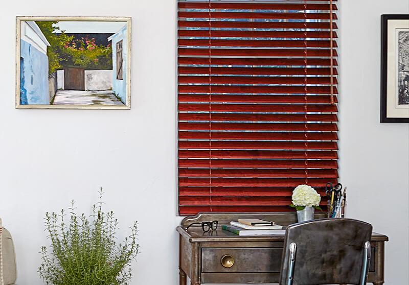 Sleek and modern cordless wood blinds add class, privacy and light control to an office setting.