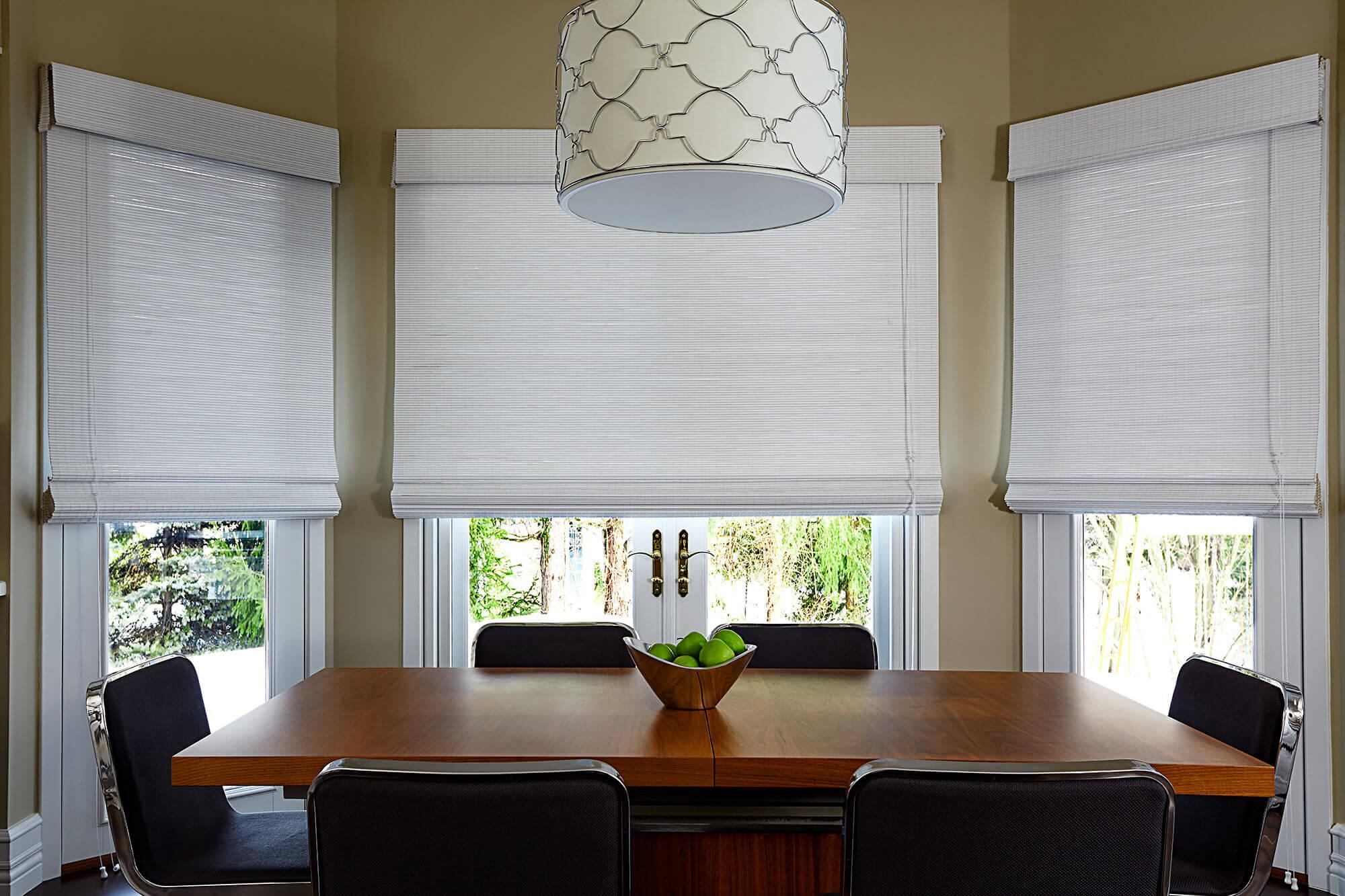 Dark brown woven wood shades sprucing up the breakfast nook. A simple yet elegant window treatment option from Blinds To Go