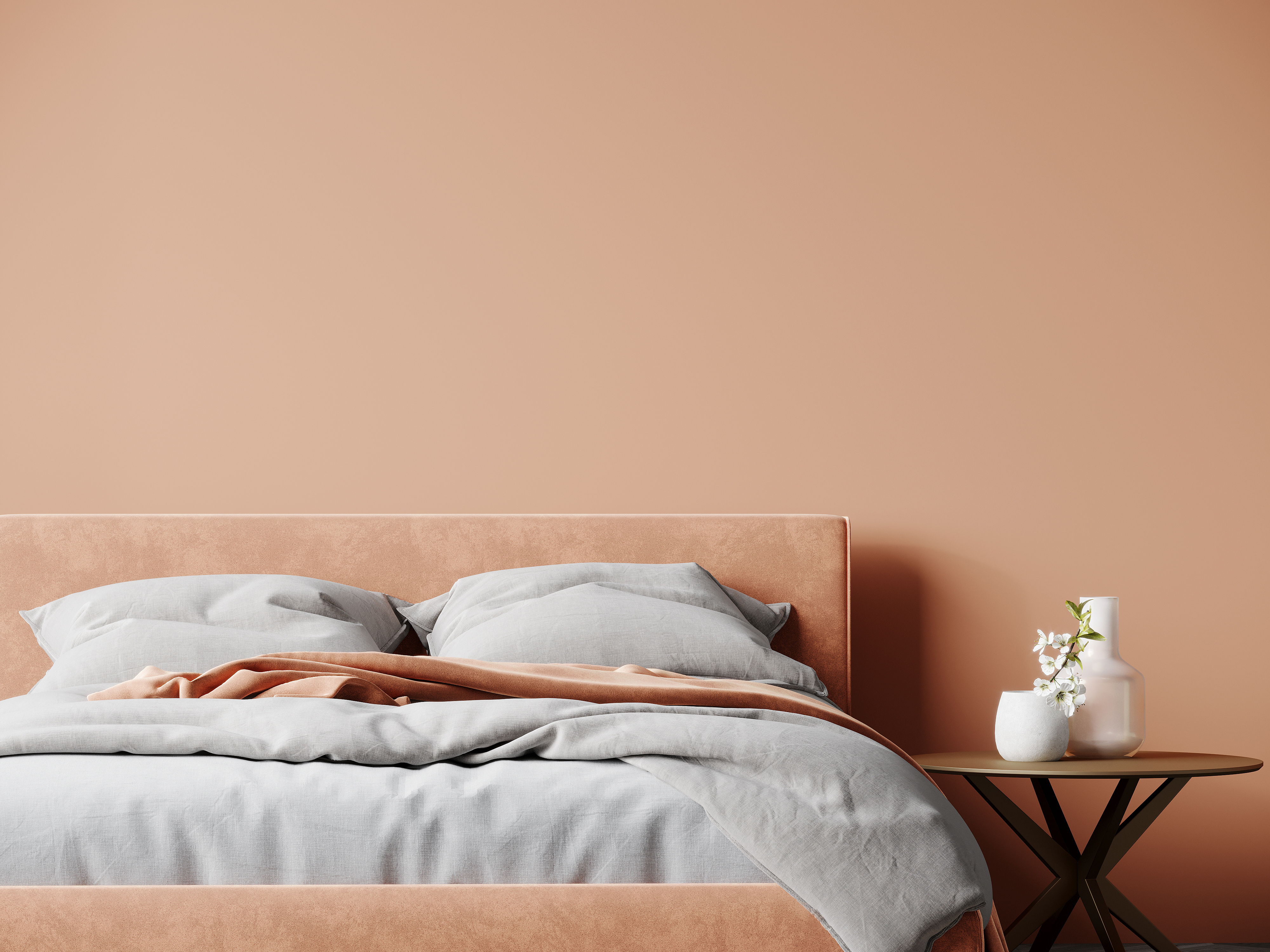 A peachy-beige beadframe rests against a wall of the exact same color for a stunning decor look.