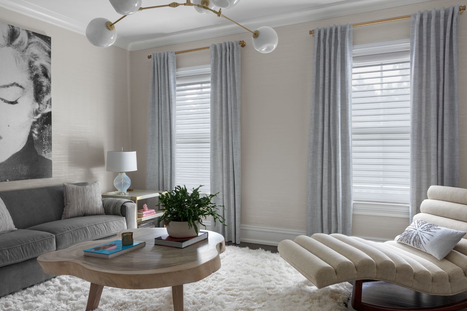 Serenity® sheer shades cover two large windows in a modern living room