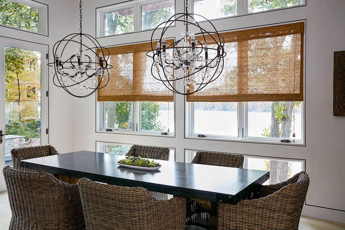 Neutral contemporary dining room with woven wood shades