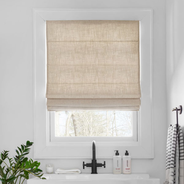 A modern and efficient sink area featuring Roman shades.