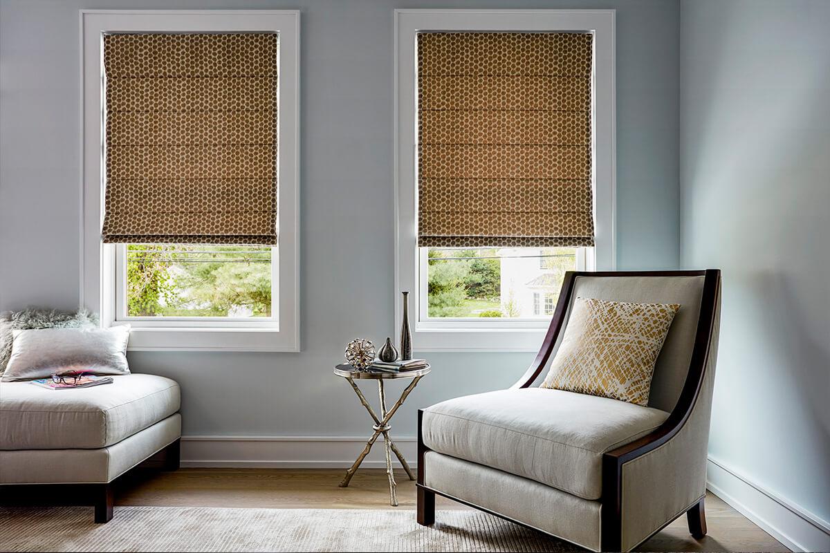 Roman shade Domino in Fossil color with flat folds in the family room.