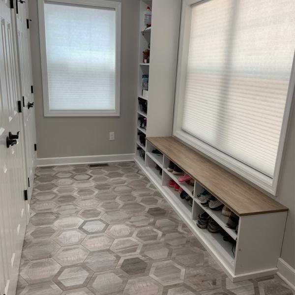 Cellular shades insulate a mudroom