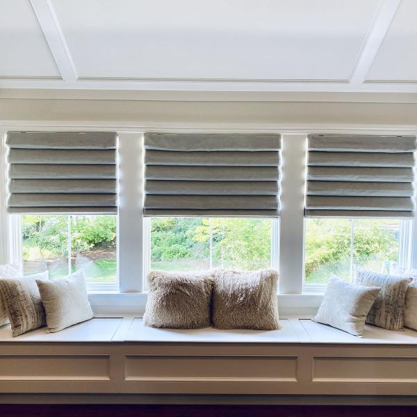 Classic fold Roman shades in a lovely sitting nook