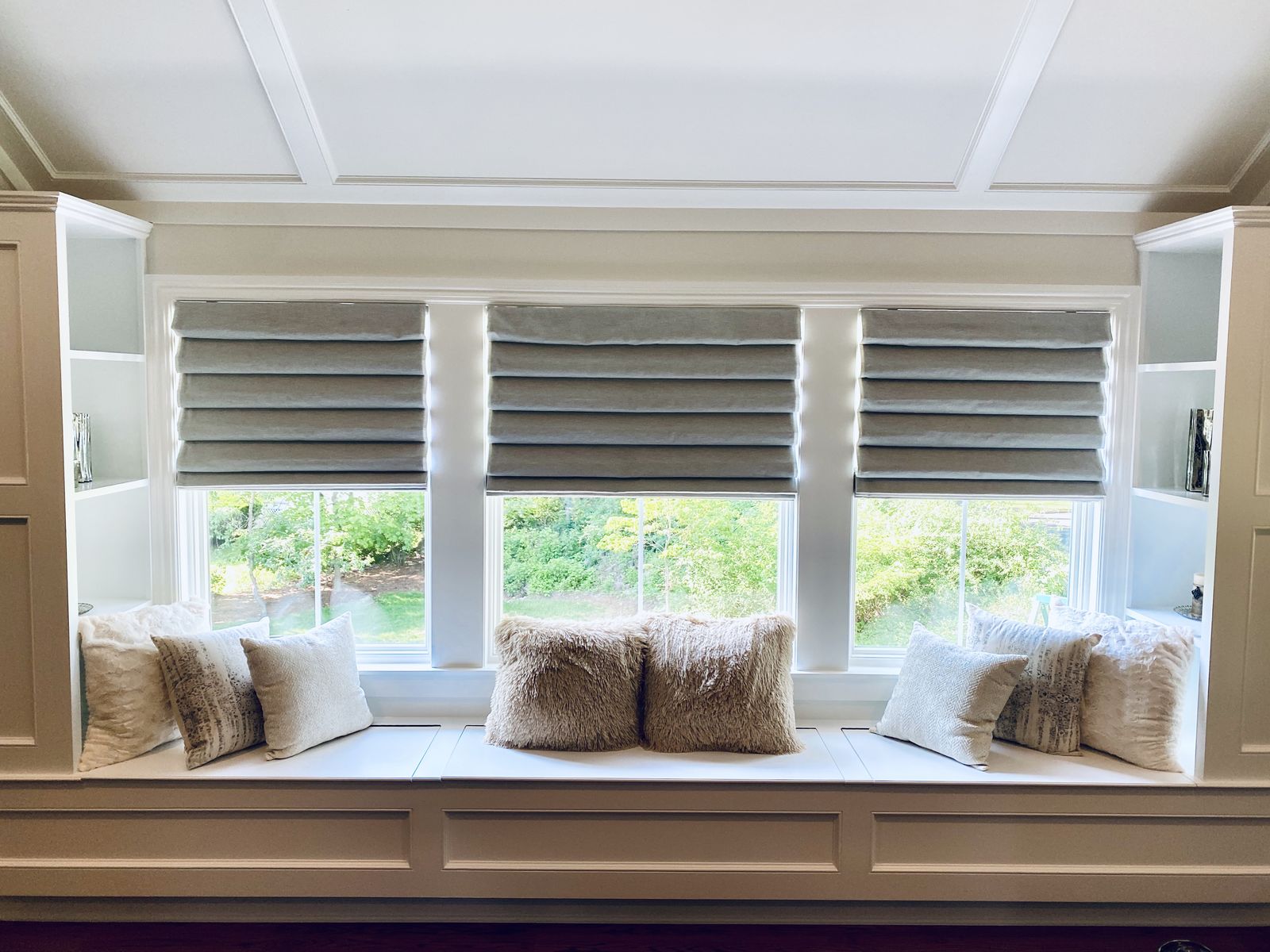 Classic fold Roman shades in a lovely sitting nook