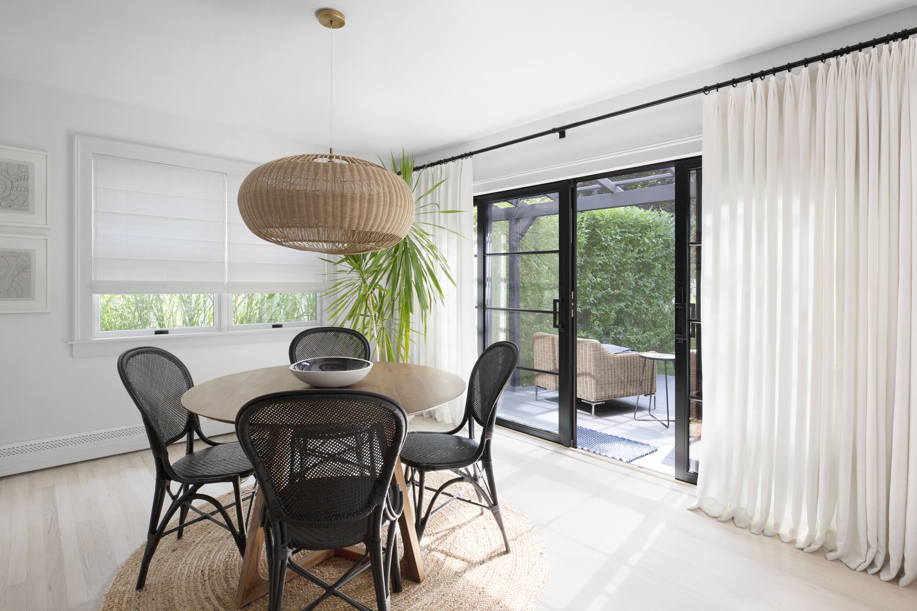 Sheer ceiling mounted drapery in a natural-inspired kitchen with an organic design aesthetic. Sheer ceiling mounted drapery in a natural-inspired kitchen with an organic design aesthetic.