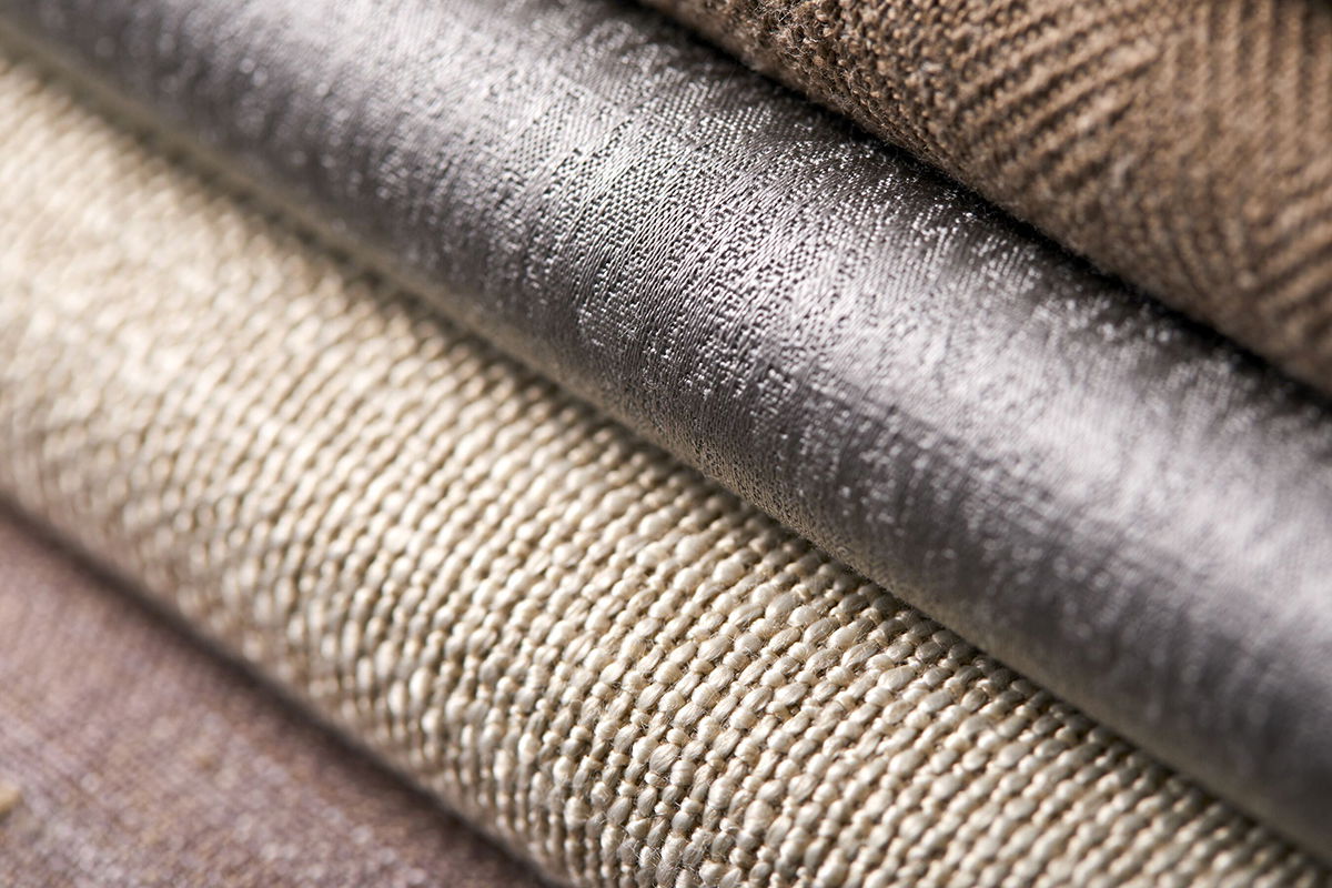 A close up of swatches of various roller shade materials show a variety of colors and textures. A close up of swatches of various roller shade materials show a variety of colors and textures.