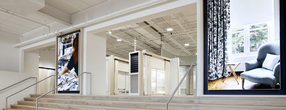 Interior of Blinds To Go East Hanover flagship store with diverse window treatment options on display.