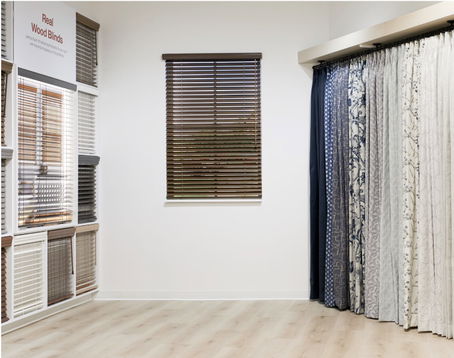 Interior of Blinds To Go East Hanover store showcasing a drapery & blinds display with various fabric options.