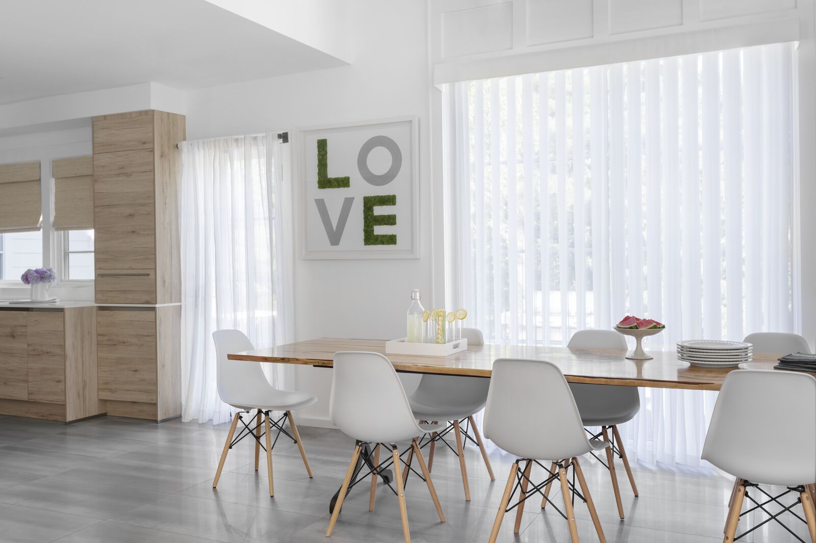 Vertical sheers offer privacy for large windows while allowing light to pour in Vertical sheers offer privacy for large windows while allowing light to pour in