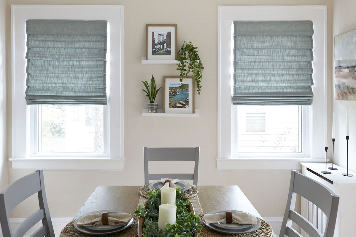 Classic-fold roman shades in sea foam green cover two windows in a small modern kitchen Classic-fold roman shades in sea foam green cover two windows in a small modern kitchen