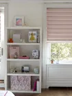 Pink roman paired with pink drapery in a modern kids room.