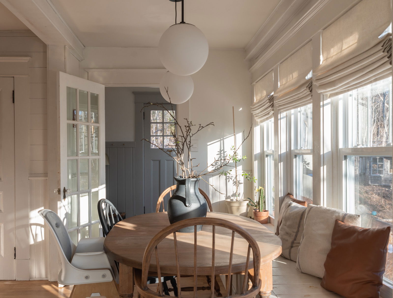 Roman shades on a wall of windows in a modern Farmhouse dining room Roman shades on a wall of windows in a modern Farmhouse dining room