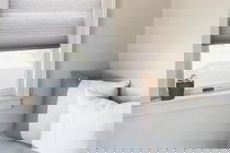 Light grey honeycomb (cellular) shades